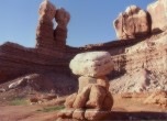 Bluff, Utah -- Sun Bonnet Rock foreground, rock formation called the Navajo Twins in the background, Lamont Crabtree Photo